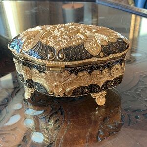 Absolutely stunning jewelry box , golden and black top, made in UAE. Must have!